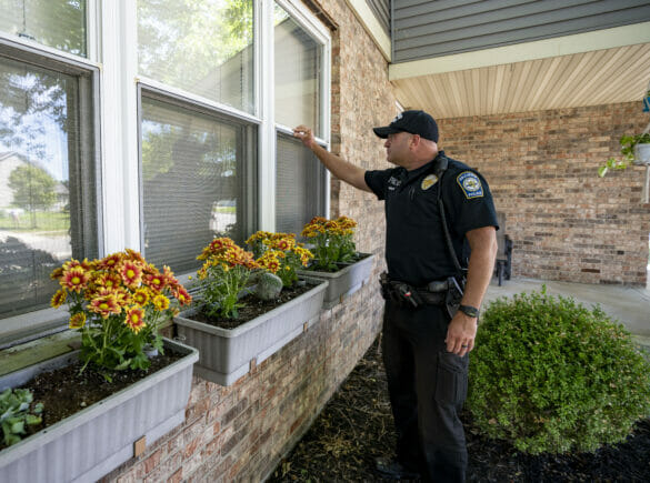 A police officers doing a vacation house check